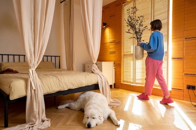 A person calmly walking out of a room while a dog watches calmly from its bed, with a relaxed posture and a chew toy nearby.