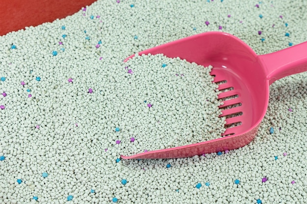 A close-up shot of crystal cat litter, showcasing its absorbent granules and highlighting its composition for odor control.