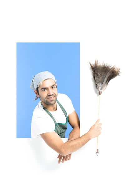 A split image. On one side, a person wearing gloves is carefully preparing raw pet food in a sanitized kitchen, emphasizing hygiene. On the other side, a microscope view showing bacteria (Salmonella or E. coli) to represent the risk of contamination.