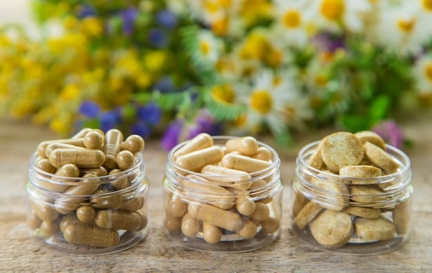 A close-up shot of various probiotic supplement capsules for dogs, with different strains listed on the labels. The background is softly blurred to focus on the capsules.