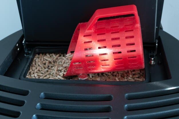 A close-up of an electric litter scoop in action, sifting through the litter and separating waste efficiently. Clumps of litter are visible, highlighting the effectiveness of the gadget.