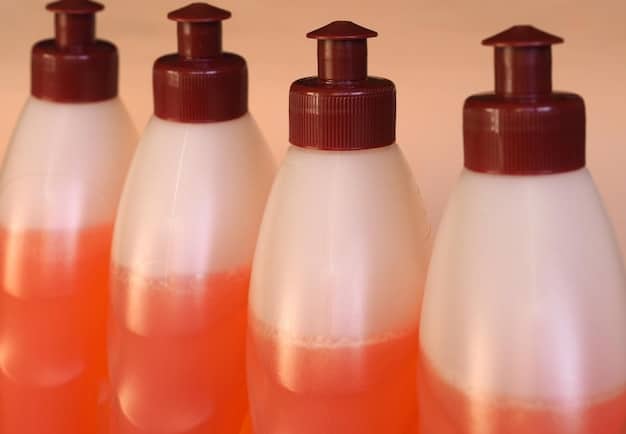 A close-up shot of several different types of pet shampoos, each labeled for specific uses like sensitive skin, flea control, and moisturizing.