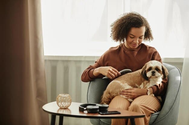 A pet owner carefully injecting insulin into their dog's scruff while sitting on the floor at home. The dog is relaxed and comfortable.
